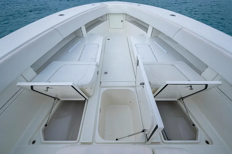 Fishy Business Yacht Photos Pics 2014 SeaVee 390B boat deck with open storage compartments, showcasing spacious design.