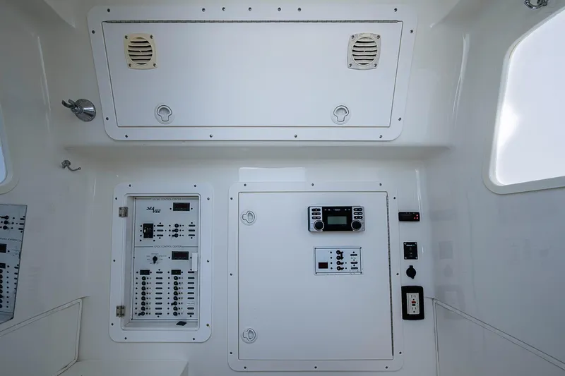 Fishy Business Yacht Photos Pics Control panel of a 2014 SeaVee 390B boat, featuring various switches and displays.