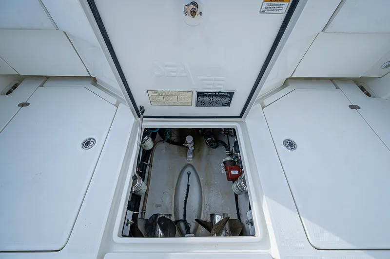 Fishy Business Yacht Photos Pics Open engine compartment of 2014 SeaVee 390B boat, showcasing internal components.
