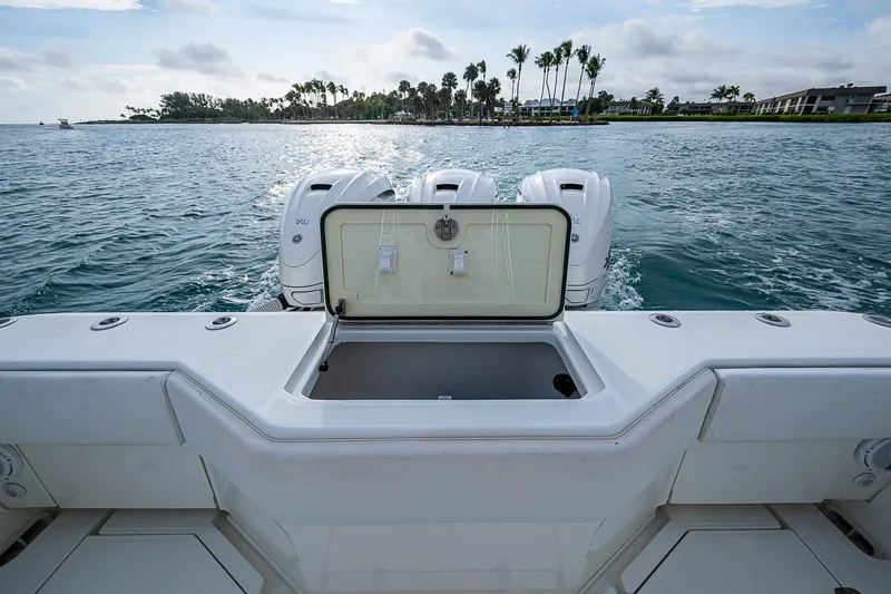 Fishy Business Yacht Photos Pics 2014 SeaVee 390B boat with open storage, triple engines, and scenic ocean view.