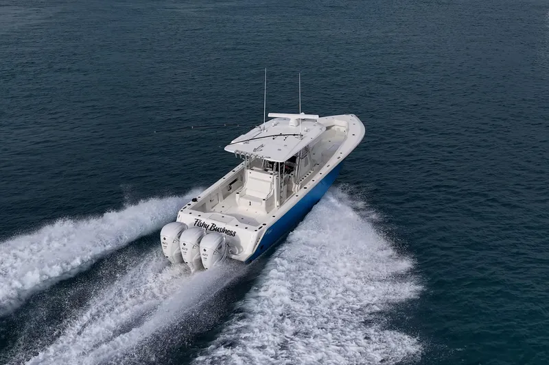 Fishy Business Yacht Photos Pics 2014 SeaVee 390B boat cruising on open water with triple engines.