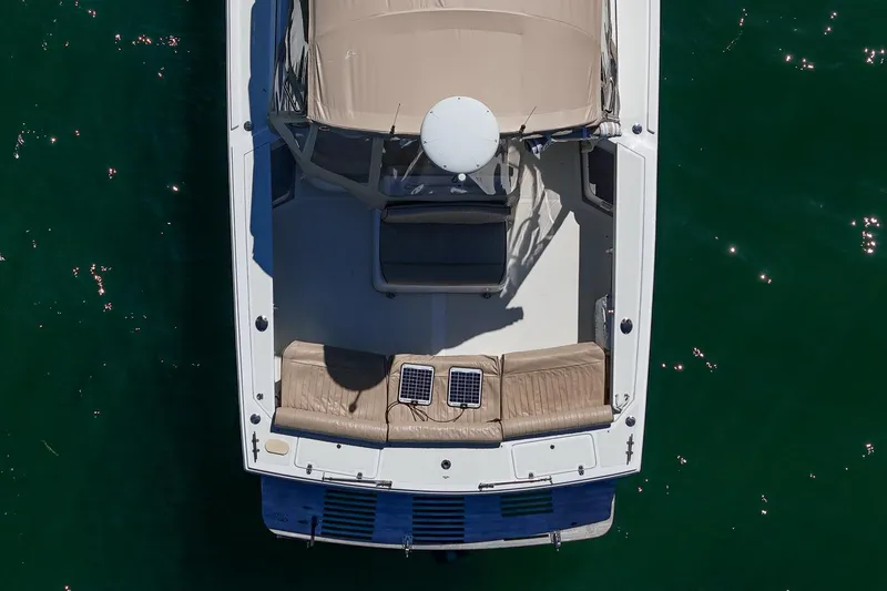 Robin Yacht Photos Pics Aerial view of 2005 Hunt Yachts Surfhunter 29 on water, showcasing deck and seating.