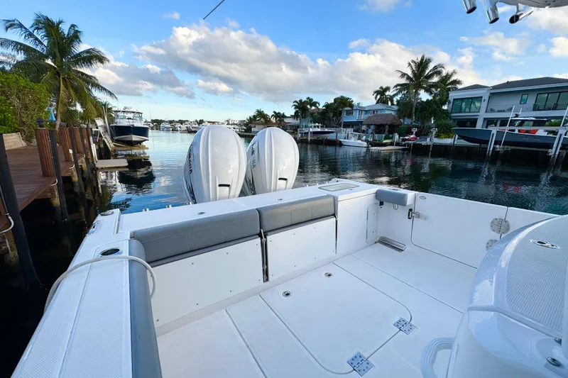  Yacht Photos Pics 2021 Everglades 335 Center Console boat docked in a scenic marina setting.