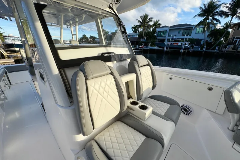  Yacht Photos Pics 2021 Everglades 335 Center Console boat interior with luxurious seating and waterfront view.