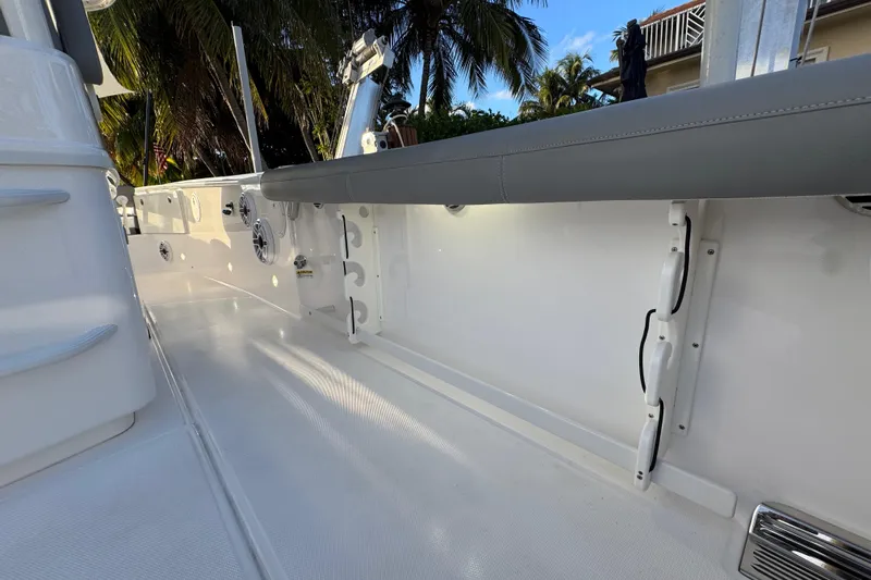  Yacht Photos Pics 2021 Everglades 335 Center Console boat interior with seating and rod holders.