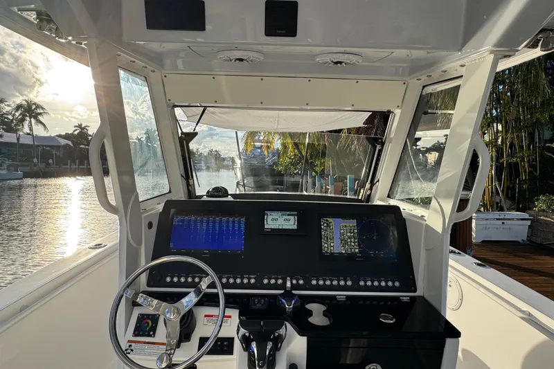  Yacht Photos Pics Interior view of 2021 Everglades 335 Center Console boat with advanced navigation system.