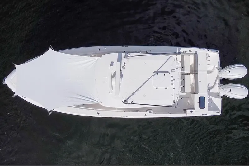  Yacht Photos Pics Overhead view of 2021 Everglades 335 Center Console boat with canopy on water.