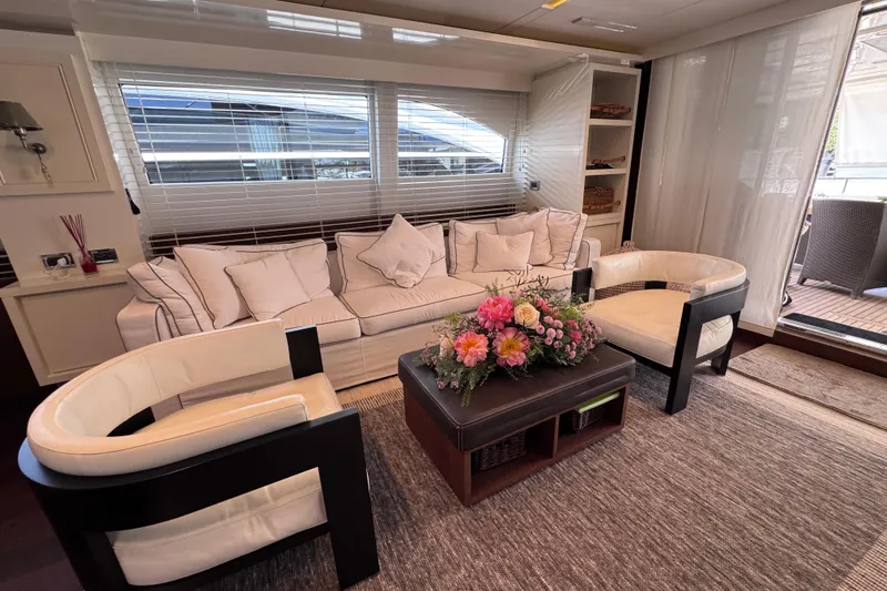  Yacht Photos Pics Luxurious interior of 2009 Canados 86 yacht with elegant seating and floral centerpiece.