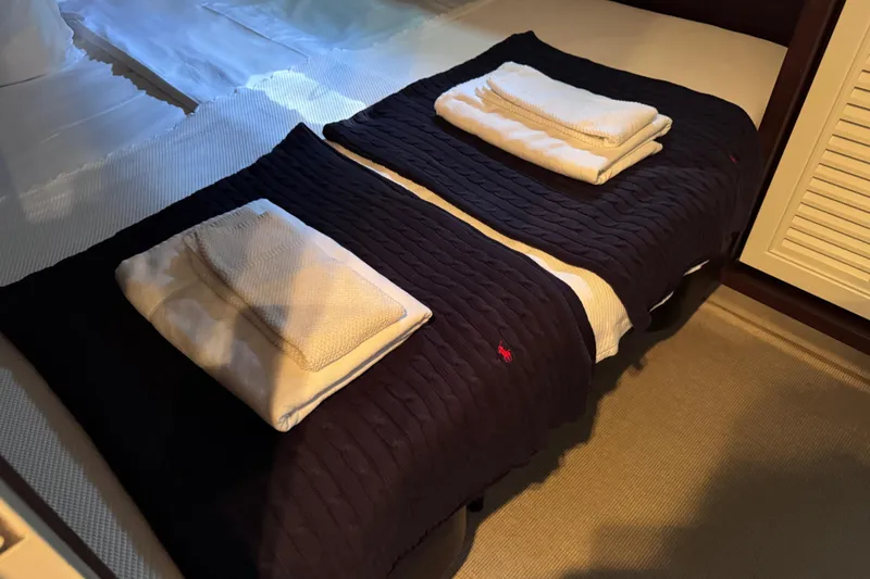  Yacht Photos Pics Luxurious cabin interior of 2009 Canados 86 yacht with neatly arranged towels.