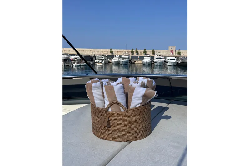  Yacht Photos Pics Basket with towels on Canados 86 yacht, 2009, docked at marina with boats.