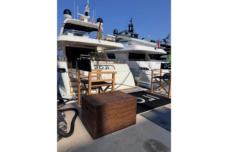  Yacht Photos Pics Luxury Canados 86 yacht docked, featuring outdoor seating and wicker storage, 2009 model.