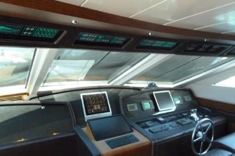  Yacht Photos Pics Cockpit of 2009 Canados 86 yacht with advanced navigation systems and steering wheel.