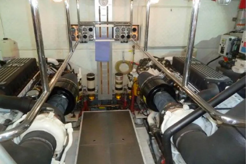  Yacht Photos Pics Engine room of a 2009 Canados 86 yacht, featuring dual engines and control panels.