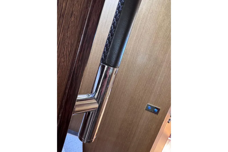  Yacht Photos Pics Luxury yacht Canados 86 interior door handle, 2009 model, featuring sleek chrome and leather design.