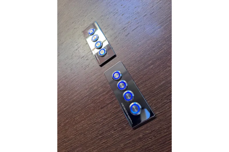  Yacht Photos Pics Sleek control panels with blue buttons on Canados 86 yacht, 2009 model.