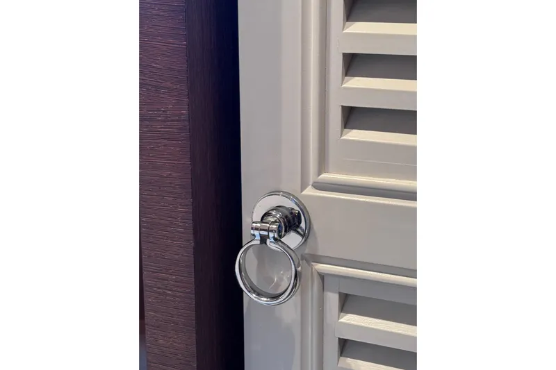  Yacht Photos Pics Chrome door handle on Canados 86 yacht, 2009 model, with wooden paneling.