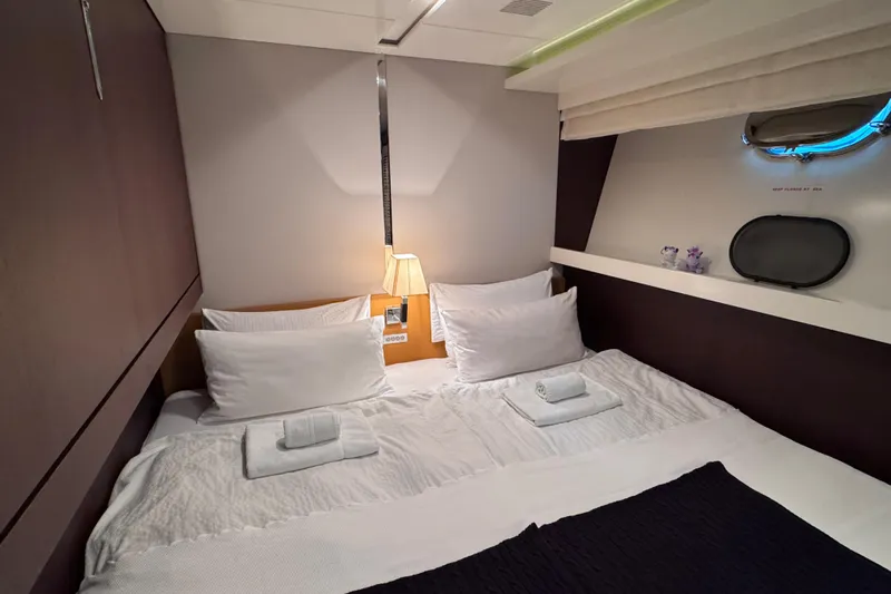  Yacht Photos Pics Luxurious bedroom interior of 2009 Canados 86 yacht with elegant bedding and soft lighting.