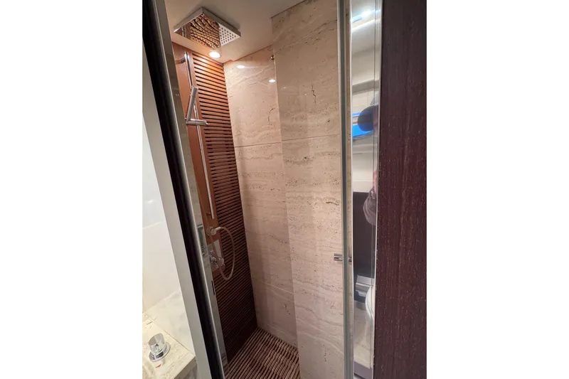  Yacht Photos Pics Luxurious shower in 2009 Canados 86 yacht with modern fixtures and elegant design.