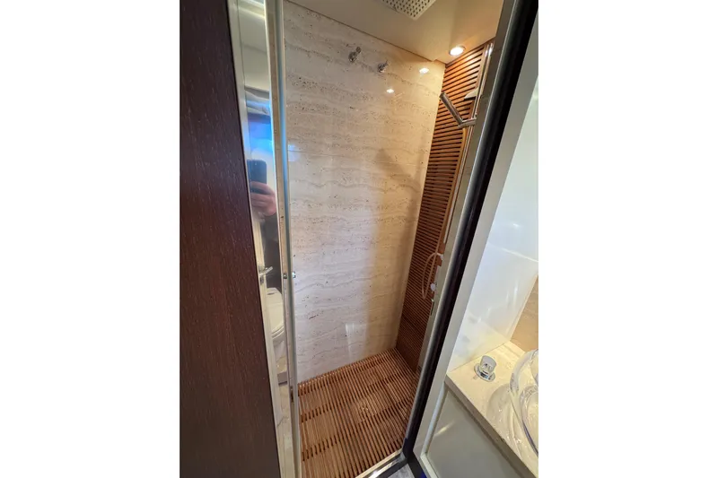  Yacht Photos Pics Luxurious shower in 2009 Canados 86 yacht with elegant wood and marble design.
