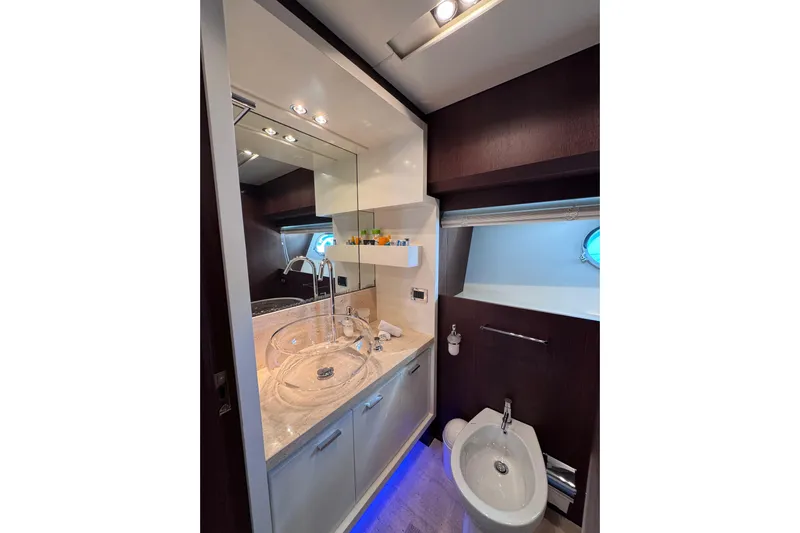 Yacht Photos Pics Luxurious bathroom in 2009 Canados 86 yacht with modern fixtures and elegant design.