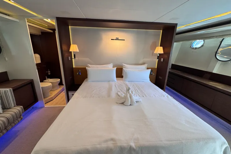  Yacht Photos Pics Luxurious bedroom interior of 2009 Canados 86 yacht with elegant decor and en-suite bathroom.