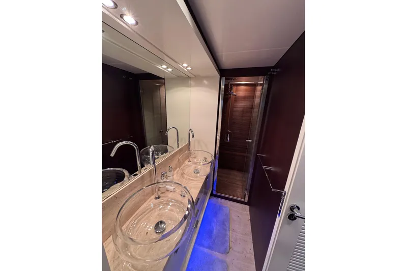  Yacht Photos Pics Luxurious bathroom in 2009 Canados 86 yacht with dual glass sinks and modern shower.