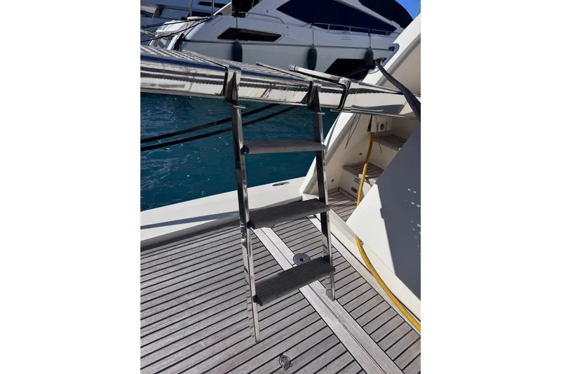  Yacht Photos Pics Stainless steel ladder on 2009 Canados 86 yacht deck, with ocean view.