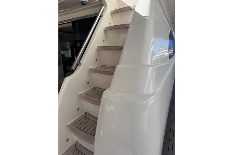  Yacht Photos Pics Staircase on 2009 Canados 86 yacht with sleek design and wooden steps.