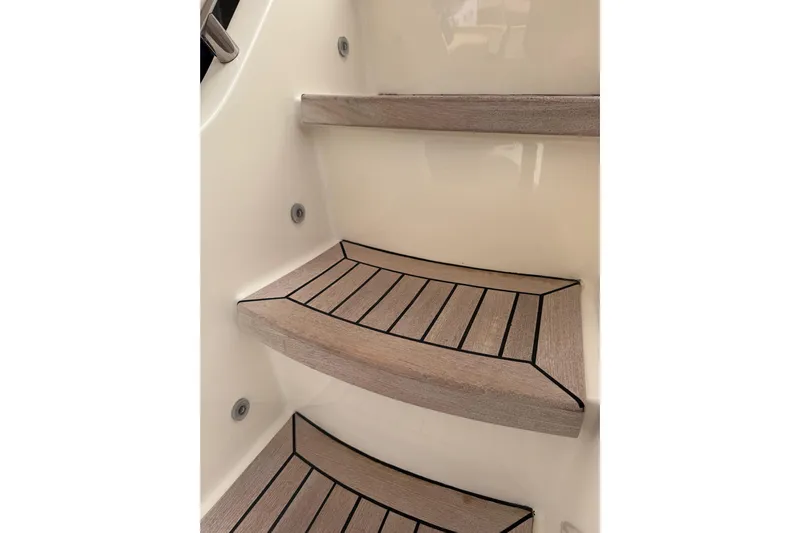  Yacht Photos Pics Wooden steps on a 2009 Canados 86 yacht interior staircase.