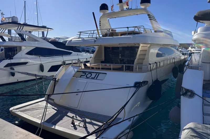  Yacht Photos Pics Luxury Canados 86 yacht from 2009 docked in a marina, rear view.