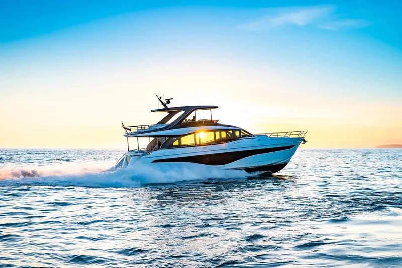 Solomon Yacht Photos Pics Luxurious 2025 Princess Y72 yacht cruising at sunset on open sea.