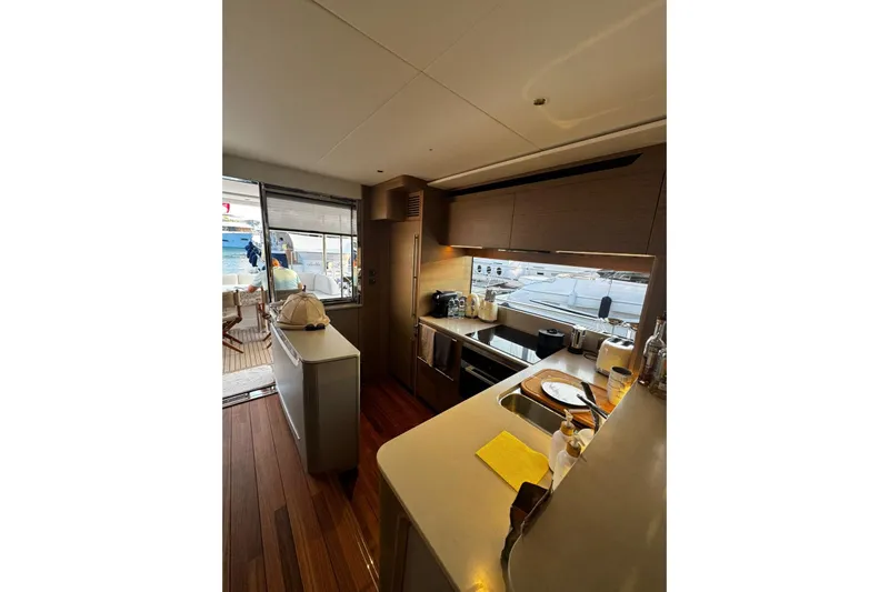 Solomon Yacht Photos Pics Luxurious kitchen interior of 2025 Princess Y72 yacht with modern appliances and sleek design.