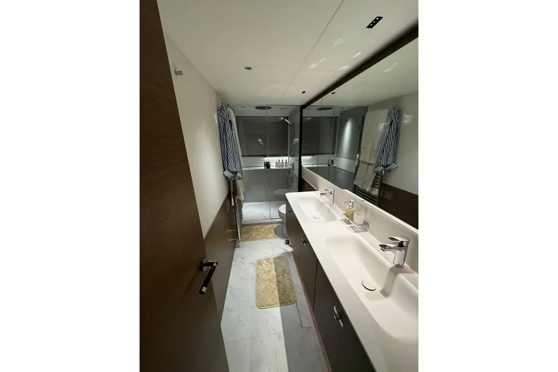 Solomon Yacht Photos Pics Luxurious bathroom in 2025 Princess Y72 yacht with dual sinks and modern design.