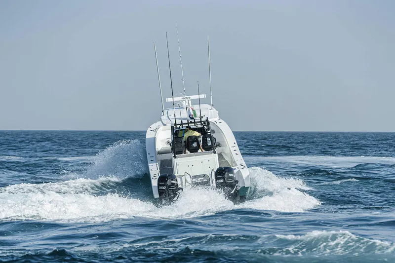  Yacht Photos Pics SilverCAT 34CC 2026 boat navigating ocean waves, rear view.