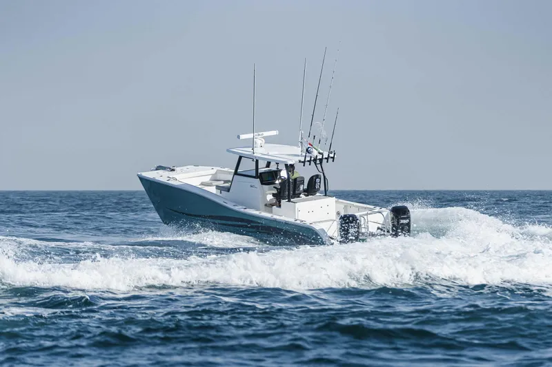  Yacht Photos Pics SilverCAT 34CC 2026 boat cruising on open sea with fishing rods.