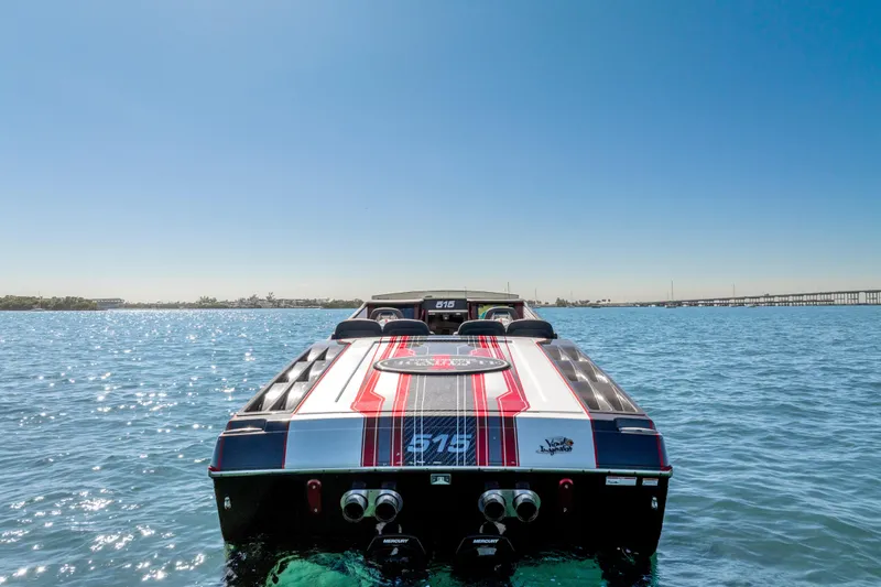  Yacht Photos Pics 2020 Cigarette 515 boat on water, showcasing sleek design and vibrant colors.