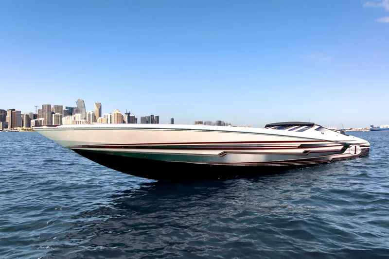  Yacht Photos Pics 2020 Cigarette 515 speedboat on water with city skyline in background.