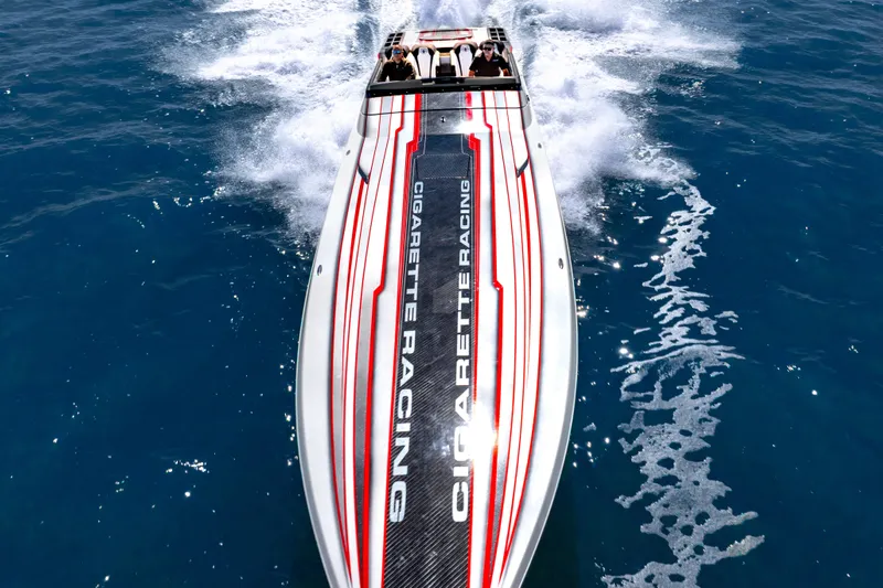  Yacht Photos Pics 2020 Cigarette 515 racing boat speeding on open water, top view.