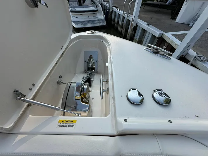  Yacht Photos Pics 2024 Grady-White Freedom 335 boat anchor compartment with open hatch at dock.