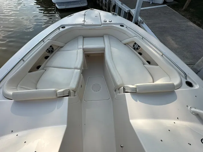  Yacht Photos Pics 2024 Grady-White Freedom 335 boat with spacious white seating area at dock.