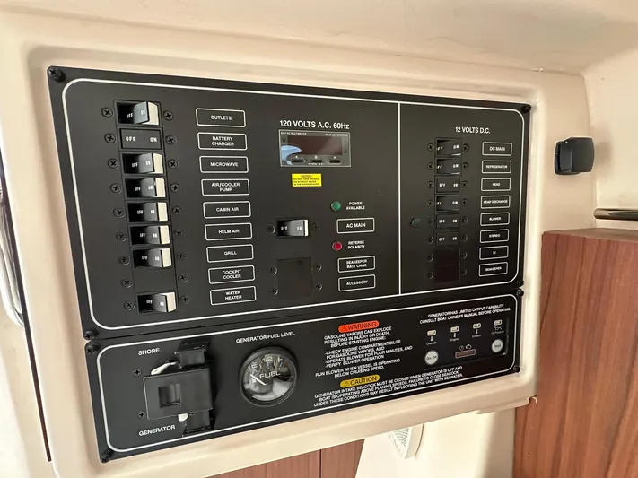  Yacht Photos Pics Electrical control panel on 2024 Grady-White Freedom 335 boat, featuring switches and gauges.