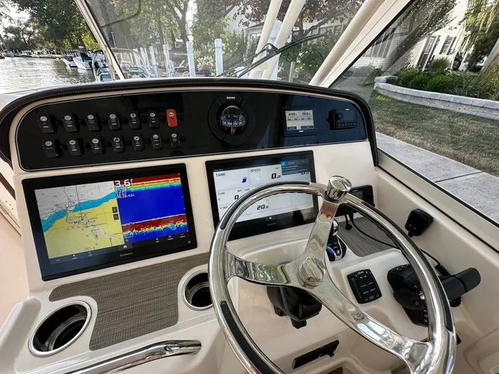  Yacht Photos Pics 2024 Grady-White Freedom 335 helm with advanced navigation displays and controls.