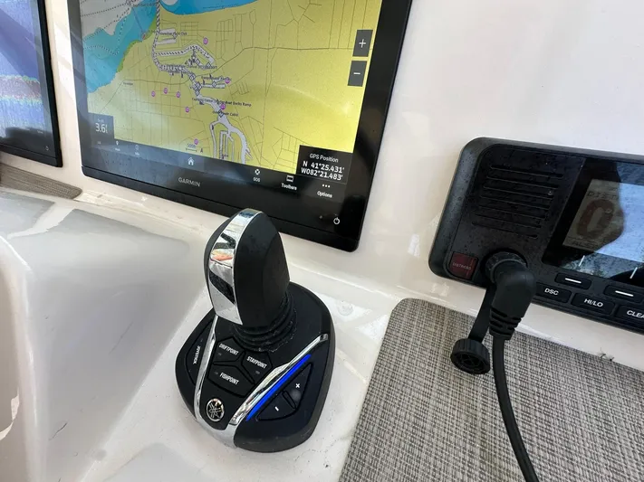 Yacht Photos Pics 2024 Grady-White Freedom 335 boat dashboard with Garmin navigation and joystick controls.