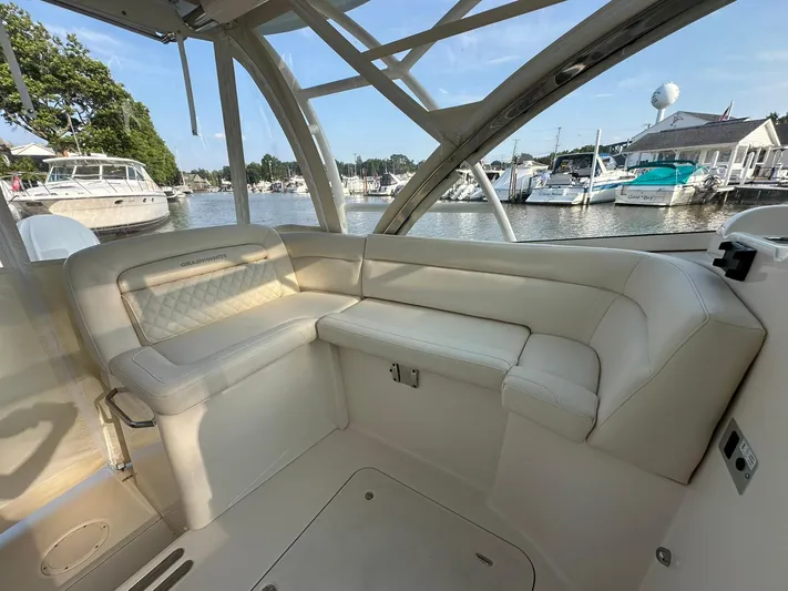  Yacht Photos Pics 2024 Grady-White Freedom 335 boat interior with luxurious seating at marina.
