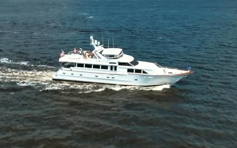 Miss Emily Yacht Photos Pics 1990 Broward Motor Yacht Extraordinaire cruising on open water.