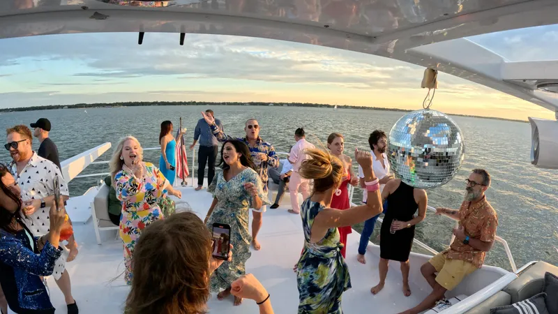 Miss Emily Yacht Photos Pics People dancing on a 1990 Broward Motor Yacht Extraordinaire with a disco ball.