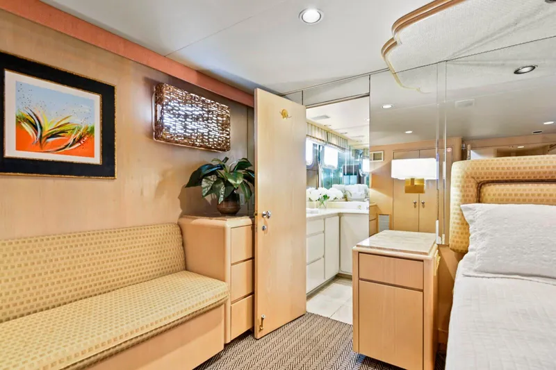 Miss Emily Yacht Photos Pics Luxurious 1990 Broward Motor Yacht interior with elegant bedroom and bathroom.