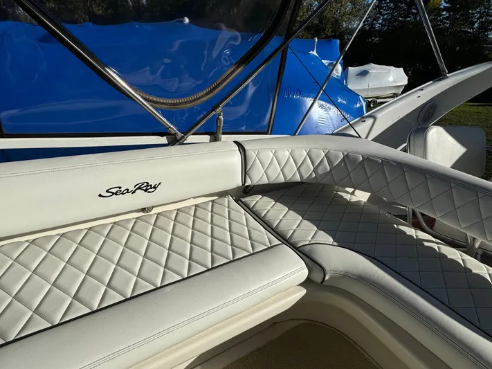 Lady Slipper Yacht Photos Pics 1996 Sea Ray 400 Sedan Bridge with white quilted seating and blue cover.