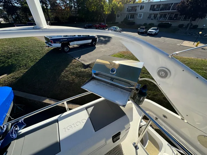 Lady Slipper Yacht Photos Pics 1996 Sea Ray 400 Sedan Bridge with outdoor grill on deck, parked near residential area.