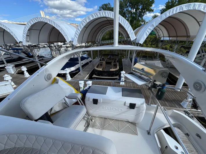 Lady Slipper Yacht Photos Pics 1996 Sea Ray 400 Sedan Bridge yacht docked, featuring a spacious deck and covered marina.